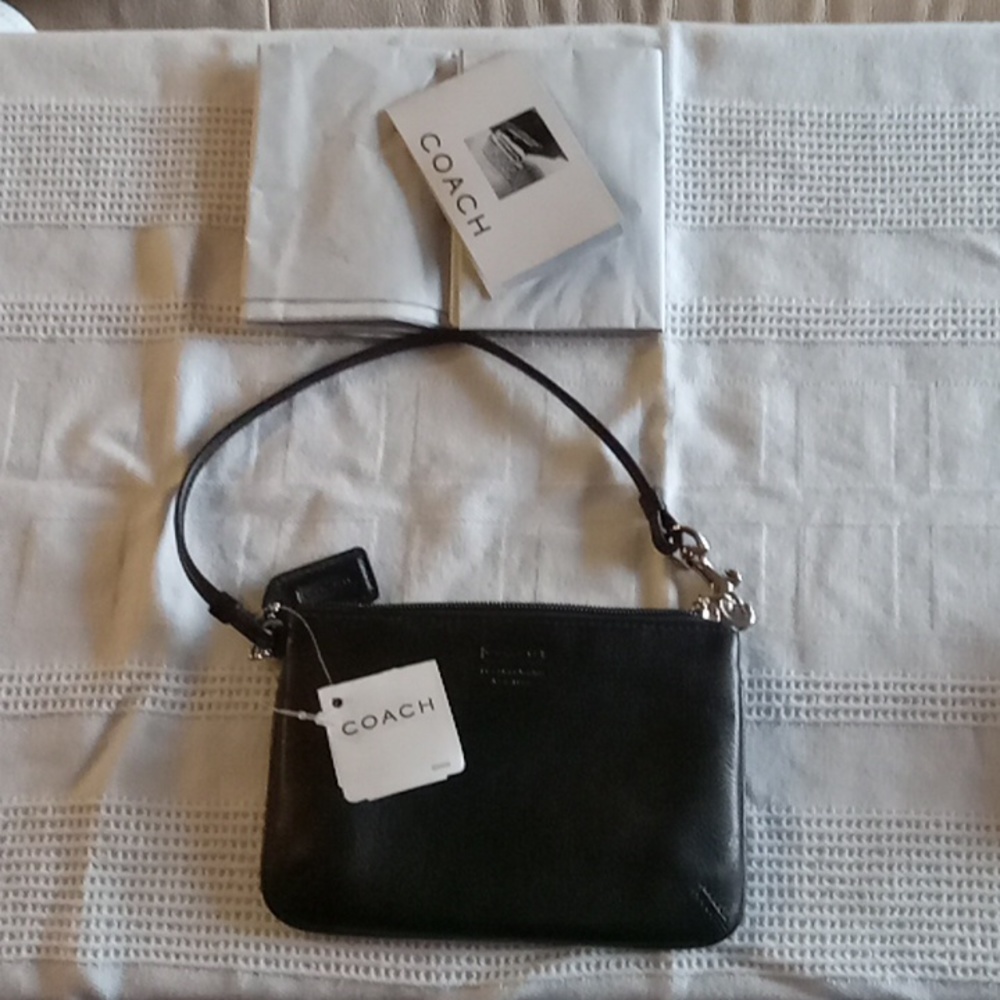Coach  black leather wristlet Skinny 8360 4"×6" Made in NY in 2000.